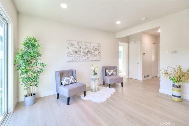 16928 Pocono St, La Puente, CA 91744 - sitting room featuring light wood-style floors, recessed lighting, and baseboards