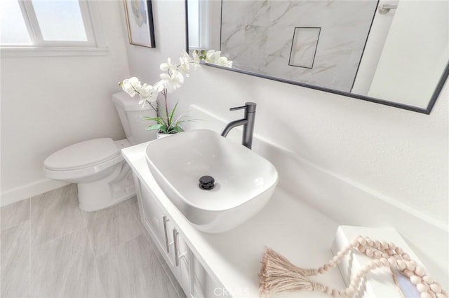 16928 Pocono St, La Puente, CA 91744 - bathroom with a sink, toilet, and baseboards
