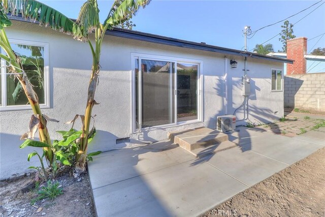 16928 Pocono St, La Puente, CA 91744 - back of house featuring stucco siding, a patio, and central AC