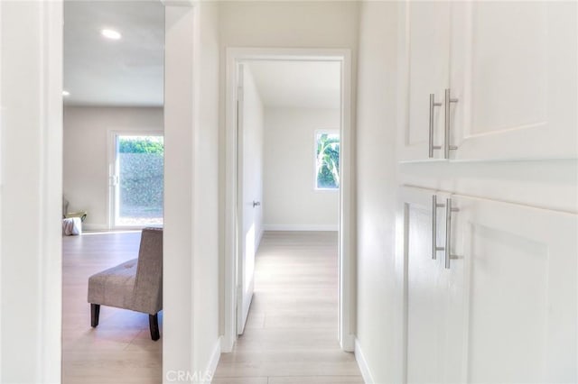 16928 Pocono St, La Puente, CA 91744 - hallway featuring light wood-style flooring, baseboards, and recessed lighting