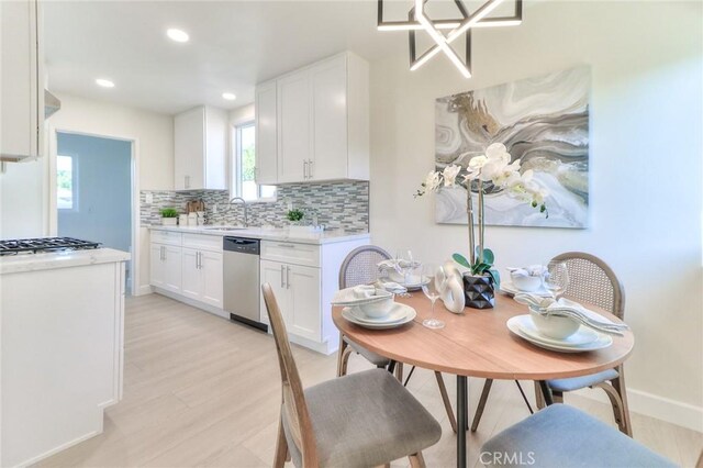16928 Pocono St, La Puente, CA 91744 - dining area with light wood-style flooring, recessed lighting, and baseboards