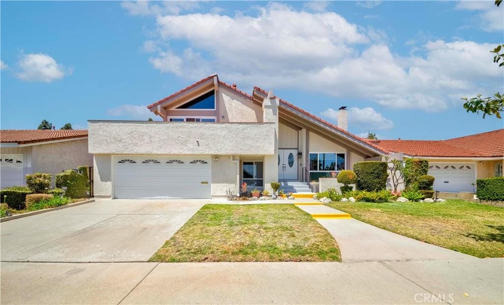 12933 Lucas Ln, Cerritos, CA 90703 - mid-century home featuring stucco siding, a front lawn, an attached garage, and a chimney