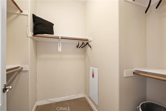 spacious closet featuring tile patterned flooring