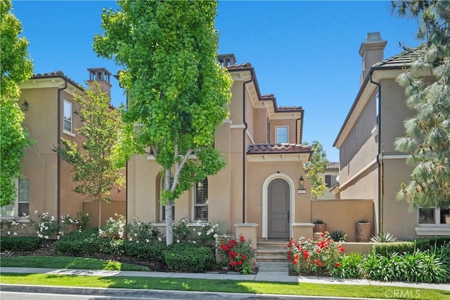 182 Rhapsody, Irvine, CA 92620 - mediterranean / spanish-style house featuring stucco siding and a tiled roof
