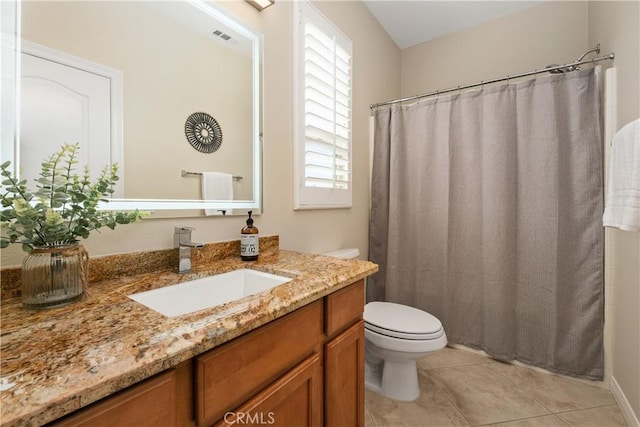 bathroom featuring toilet, tile patterned floors, vanity, and a shower with shower curtain