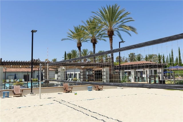 view of property's community featuring volleyball court and a pool