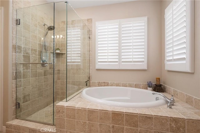 182 Rhapsody, Irvine, CA 92620 - full bath featuring a garden tub, a stall shower, and plenty of natural light