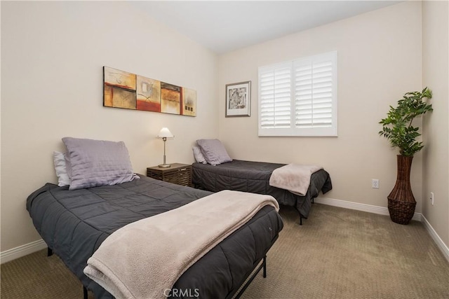 bedroom featuring carpet flooring and baseboards