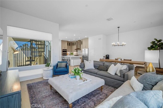 2047 Doheny Way, Dana Point, CA 92629 - living room featuring a chandelier, light wood-style floors, and recessed lighting