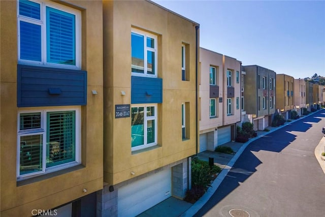 2047 Doheny Way, Dana Point, CA 92629 - view of building exterior with an attached garage and a residential view