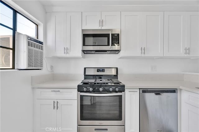 18530 Hatteras St Unit 209, Tarzana, CA 91356 - kitchen with stainless steel appliances, white cabinets, and light countertops