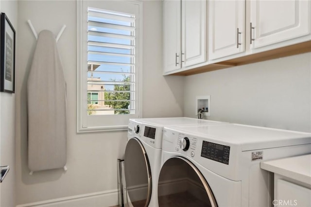 132 Interval, Irvine, CA 92618 - laundry area with cabinet space, washer and clothes dryer, and baseboards