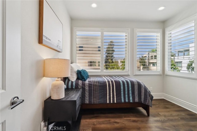 132 Interval, Irvine, CA 92618 - bedroom featuring multiple windows, wood finished floors, recessed lighting, and baseboards
