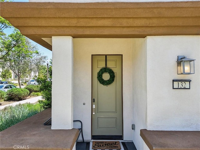 132 Interval, Irvine, CA 92618 - doorway to property with stucco siding