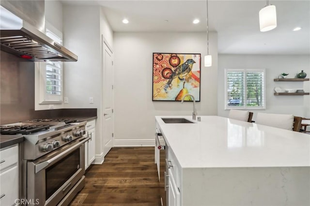 132 Interval, Irvine, CA 92618 - kitchen featuring wall chimney exhaust hood, high end stainless steel range oven, dark wood-style flooring, recessed lighting, and pendant lighting