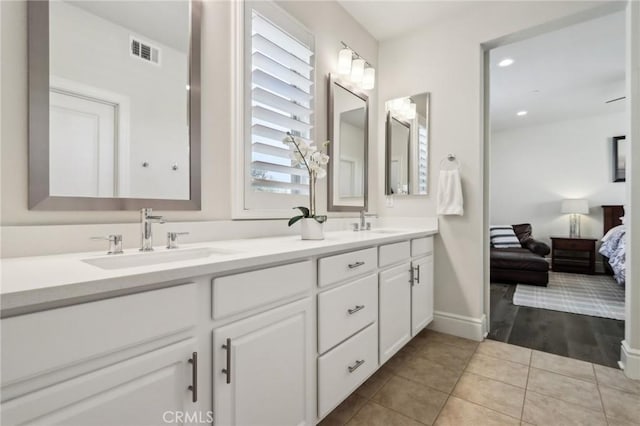 132 Interval, Irvine, CA 92618 - ensuite bathroom featuring tile patterned flooring, double vanity, baseboards, and recessed lighting