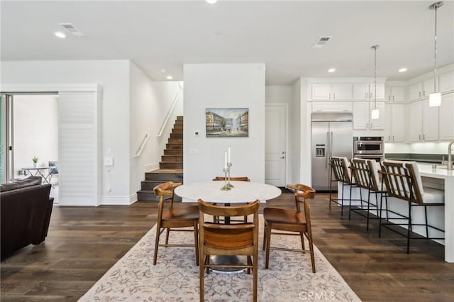 132 Interval, Irvine, CA 92618 - dining area featuring stairs, dark wood-type flooring, baseboards, and recessed lighting