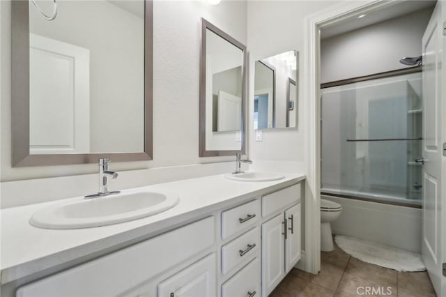 132 Interval, Irvine, CA 92618 - bathroom with toilet, double vanity, tile patterned flooring, and enclosed tub / shower combo