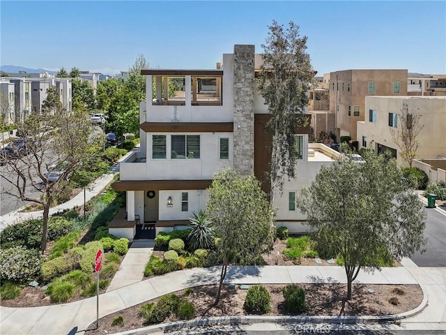 132 Interval, Irvine, CA 92618 - view of front of house with stucco siding