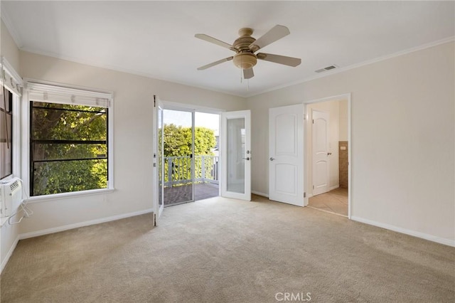 spare room with carpet flooring, baseboards, ceiling fan, and ornamental molding