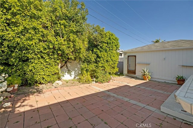 view of patio featuring fence