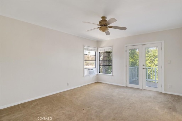 unfurnished room with french doors, baseboards, carpet floors, and plenty of natural light