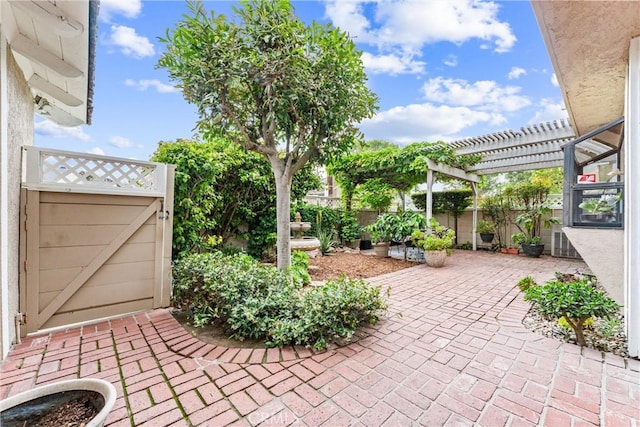 15 Firestone Unit 4, Irvine, CA 92614 - view of patio / terrace featuring a gate and a pergola