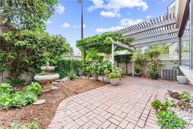 15 Firestone Unit 4, Irvine, CA 92614 - view of patio with a fenced backyard and a pergola