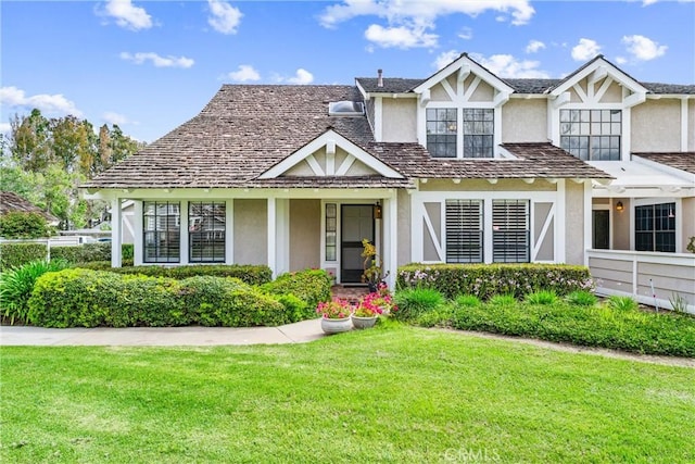 15 Firestone Unit 4, Irvine, CA 92614 - tudor home with stucco siding and a front yard