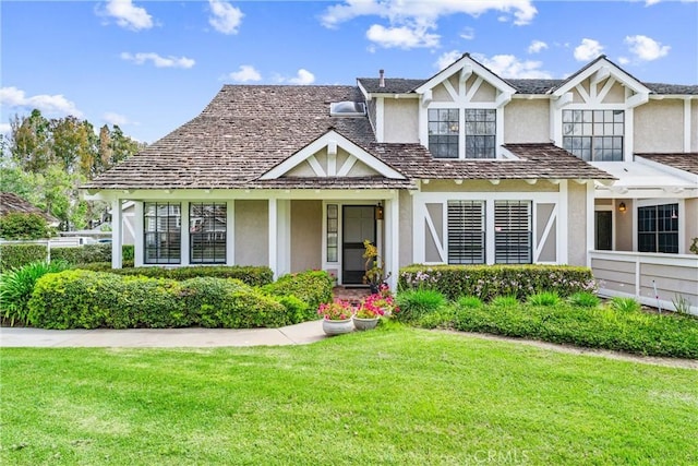 15 Firestone Unit 4, Irvine, CA 92614 - tudor-style house with stucco siding and a front lawn
