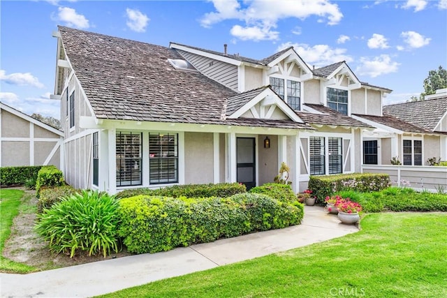 15 Firestone Unit 4, Irvine, CA 92614 - view of front of house featuring stucco siding and a front lawn