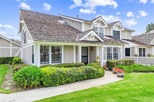 15 Firestone Unit 4, Irvine, CA 92614 - view of front of property with stucco siding and a front yard