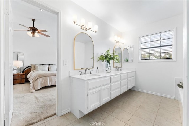 15 Firestone Unit 4, Irvine, CA 92614 - bathroom with a ceiling fan, tile patterned flooring, double vanity, ensuite bath, and baseboards