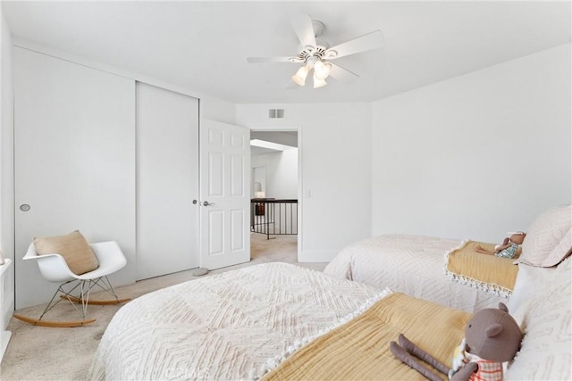 15 Firestone Unit 4, Irvine, CA 92614 - bedroom featuring light colored carpet, a closet, and ceiling fan