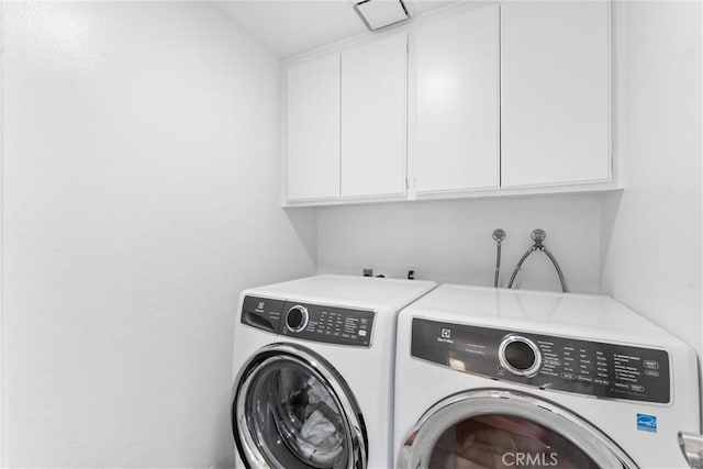 15 Firestone Unit 4, Irvine, CA 92614 - laundry area featuring cabinet space and washing machine and dryer