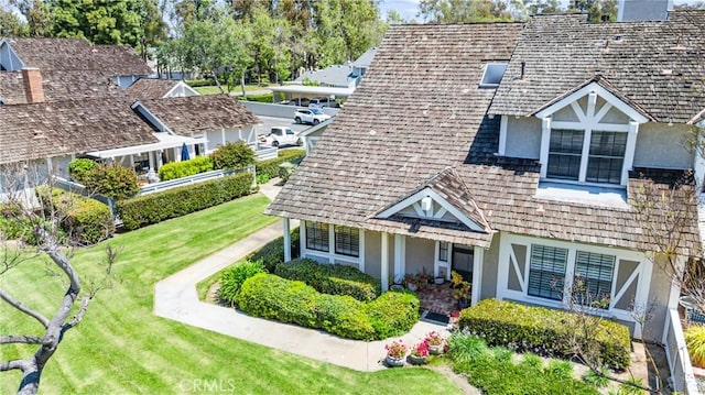 15 Firestone Unit 4, Irvine, CA 92614 - exterior space featuring stucco siding and a front lawn