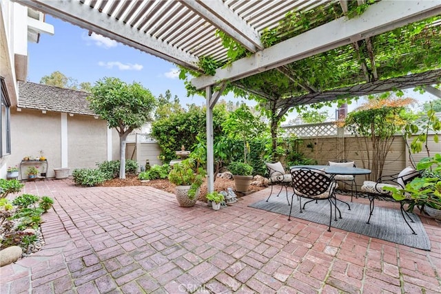 15 Firestone Unit 4, Irvine, CA 92614 - view of patio featuring a fenced backyard, outdoor dining space, and a pergola