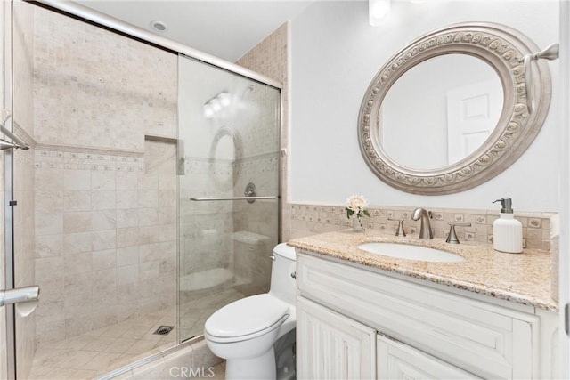 15 Firestone Unit 4, Irvine, CA 92614 - full bathroom featuring toilet, a stall shower, and vanity