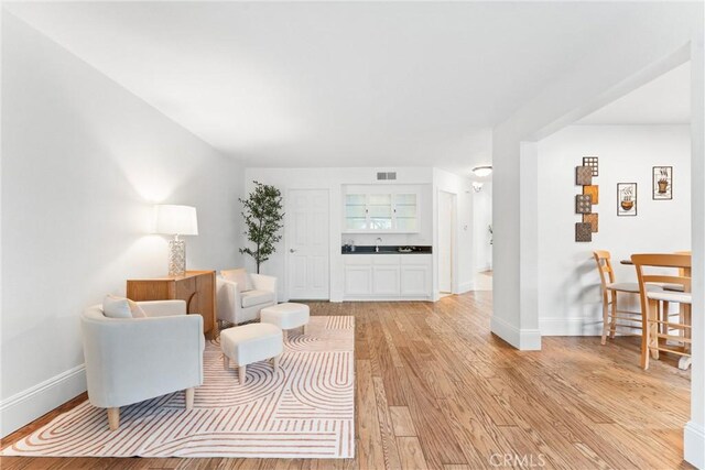 15 Firestone Unit 4, Irvine, CA 92614 - living room with light wood-style flooring and baseboards