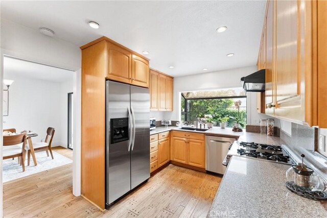 15 Firestone Unit 4, Irvine, CA 92614 - kitchen featuring appliances with stainless steel finishes, a sink, light wood-style floors, light brown cabinetry, and recessed lighting