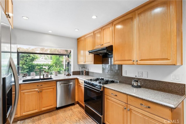 15 Firestone Unit 4, Irvine, CA 92614 - kitchen featuring stainless steel appliances, a sink, under cabinet range hood, light wood-style floors, and recessed lighting