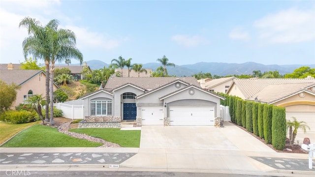 1044 Shadow Crest Cir, Corona, CA 92881 - ranch-style house featuring a garage, stucco siding, concrete driveway, and a mountain view