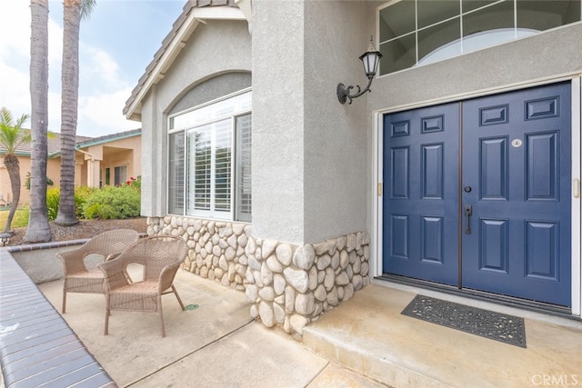 1044 Shadow Crest Cir, Corona, CA 92881 - doorway to property with stucco siding and stone siding
