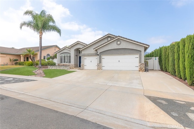 1044 Shadow Crest Cir, Corona, CA 92881 - view of front of house with a garage, stucco siding, concrete driveway, and stone siding