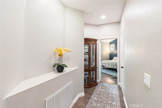 1044 Shadow Crest Cir, Corona, CA 92881 - corridor with dark wood finished floors and baseboards