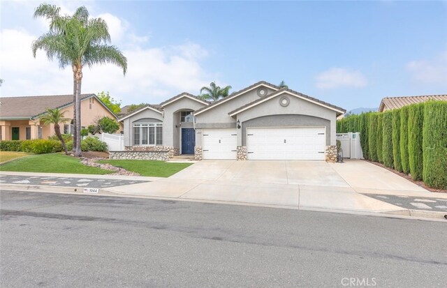 1044 Shadow Crest Cir, Corona, CA 92881 - single story home featuring stucco siding, an attached garage, and driveway
