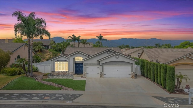 1044 Shadow Crest Cir, Corona, CA 92881 - ranch-style house with a garage, stucco siding, driveway, and a mountain view