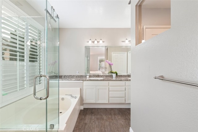 1044 Shadow Crest Cir, Corona, CA 92881 - full bath with vanity, a garden tub, a shower stall, and wood finished floors