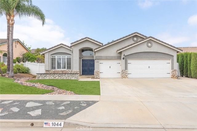 1044 Shadow Crest Cir, Corona, CA 92881 - ranch-style home with stucco siding, an attached garage, driveway, stone siding, and a tile roof