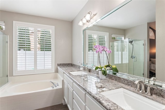 1044 Shadow Crest Cir, Corona, CA 92881 - bathroom featuring plenty of natural light, double vanity, a bath, and a shower stall